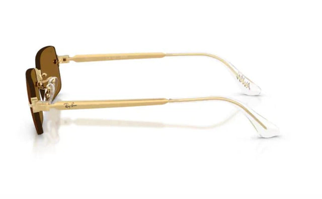 Ray-Ban x A$AP Rocky RB3928 gold rimless sunglasses with brown polarized lenses, angled view