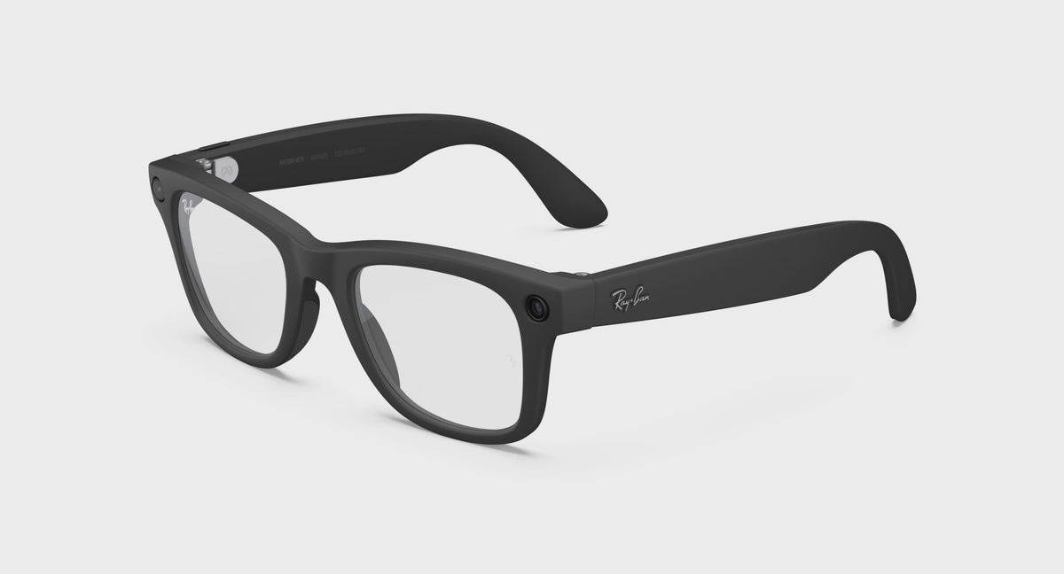 Video demonstration showing Ray-Ban Meta Wayfarer Gen 2 smart glasses with photochromic Transitions lenses transitioning smoothly from transparent clear indoor eyewear to dark grey sunglasses in outdoor UV sunlight.